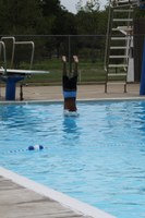 image of kid diving into swimming pool