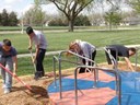 Community Service 2 members of the track team helping spread new wood chips in the play ground areas